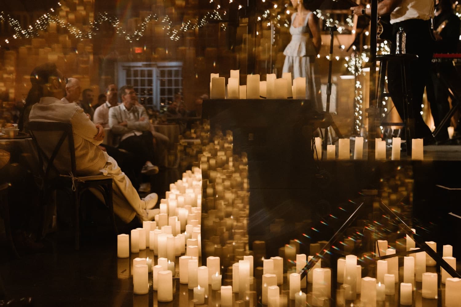 An intimate dinner set among hundreds of candles